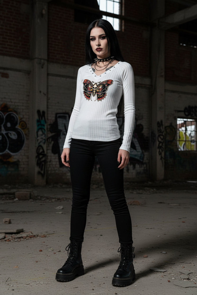 White long-sleeve shirt with a butterfly and skull design on a gray background