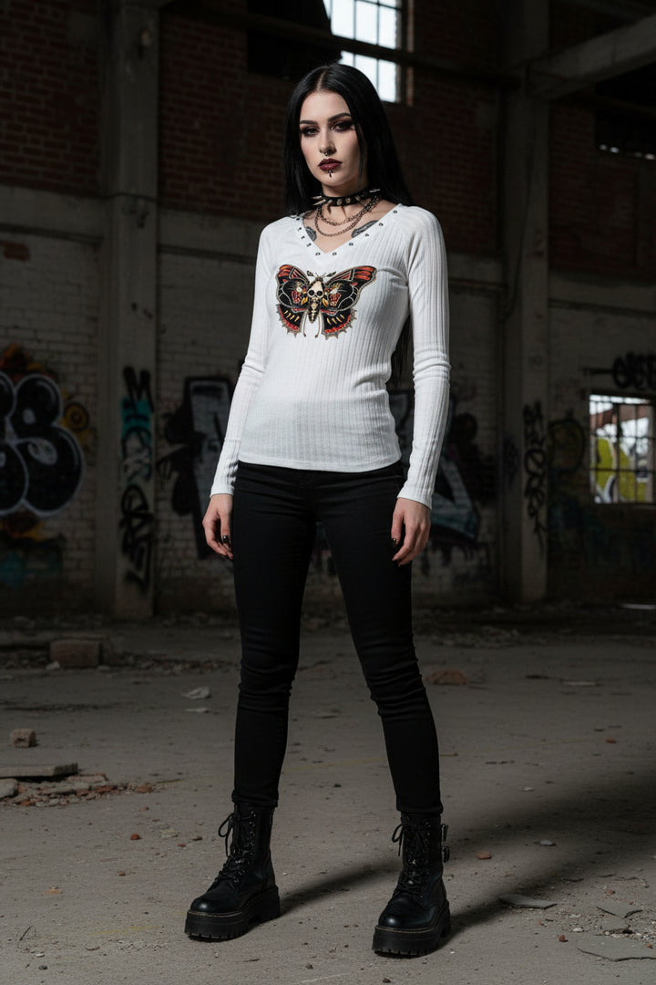 White long-sleeve shirt with a butterfly and skull design on a gray background